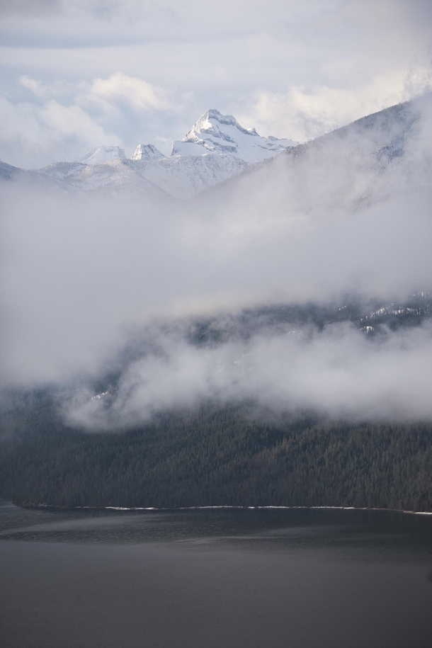 The distant Valhalla Range standing tall over Slocan Lake British Columbia 