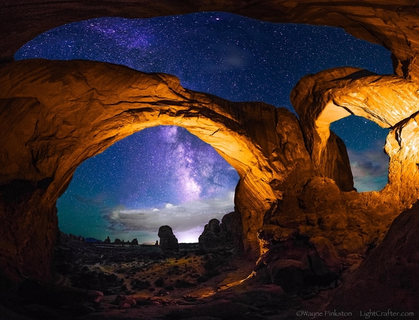 The Double Arch under the night sky Arches NP Utah  photo by Wayne Pinkston