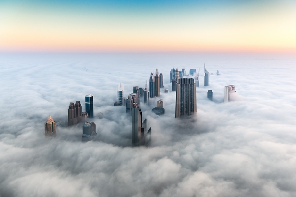 The Dubai skyline above the clouds Photo by Bjoern Lauen 