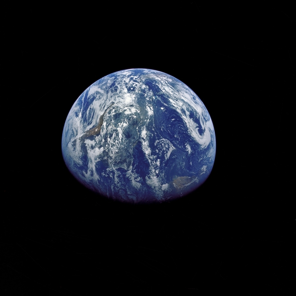 The Earth photographed by the Apollo  crewmen as they sped toward the fourth lunar landing 