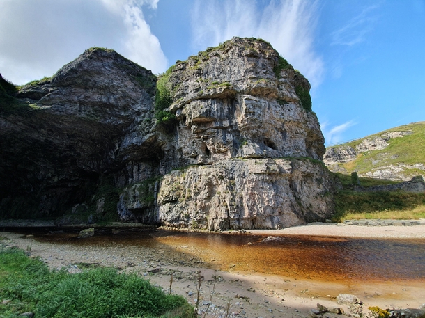 The entrance to Smoo cave in Durness Scotland An underground waterfall awaits inside 