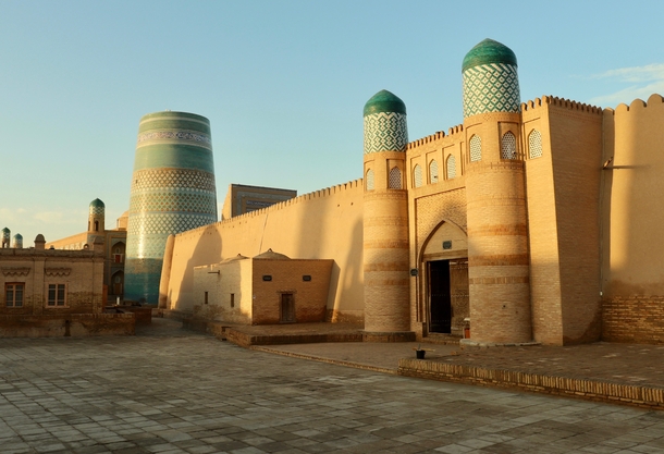 The entrance to the Kunya-ark Citadel with the Kalta Minor an unfinished minaret - Khiva Uzbekistan 