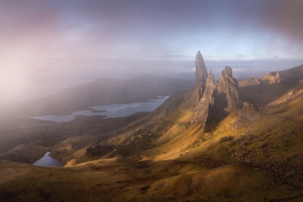 The famous Old Man of Storr appearing through the clouds 
