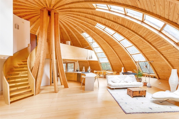 The geodesic dome house able to rotate  utilizing solar energy located in Long Island NY amidst -acre forest at the base of the Mohonk Preserve Designed and built by Domespace 