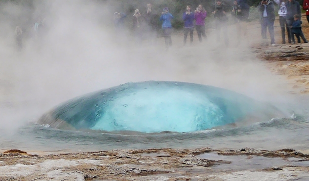 The Icelandic geyser Strokkur moments before erupting 