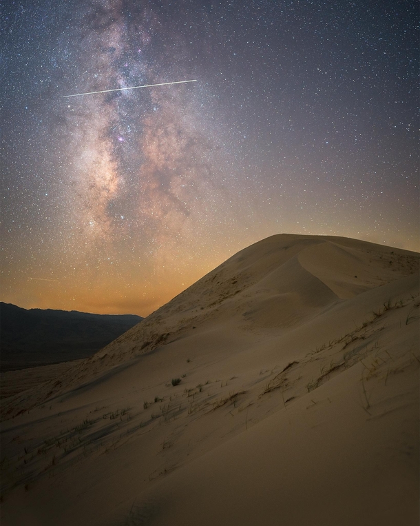 The International Space Station streaks across the Milky Way - Kelso Dunes California OC x jackfusco