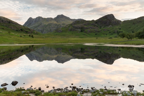 The Langdale Pikes reflecting in Blea Tarn The English Lake District 