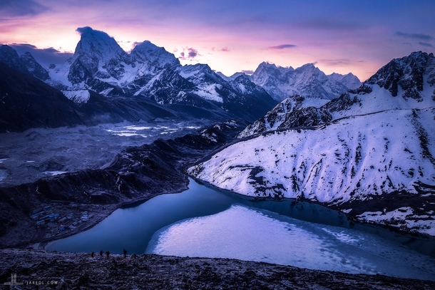 The lights of the dawn color the peeks of Mount Everest view from the still half frozen Gokyo lake m high ft in early May  Photo by Jared Lim