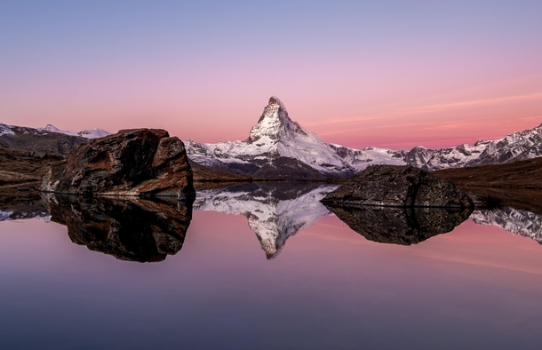 The Matterhorn and its reflection in the Stellisee just before sunrise Zermatt Switzerland 