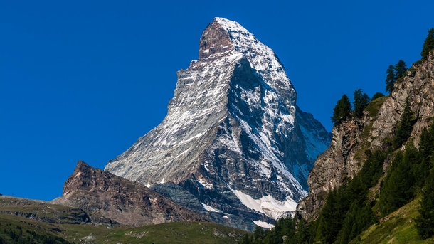 The Matterhorn German Monte Cervino Italian or Mont Cervin French is a mountain in the Pennine Alps on the border between Switzerland and Italy Its summit is  meters  ft high making it one of the highest peaks in the Alps  photo by Tomasz Wozniak