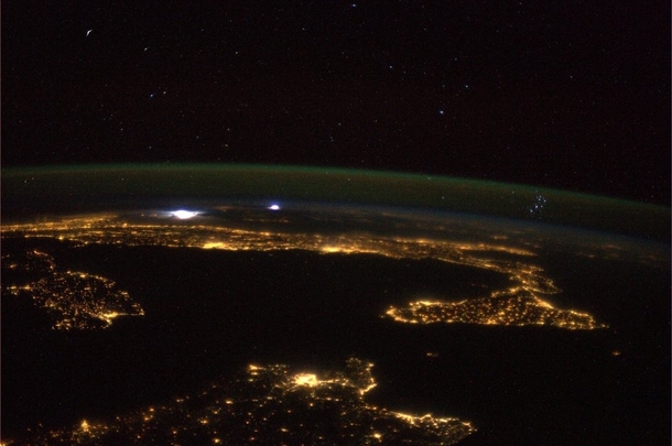 The Mediterranean the Pleiades and a storm in the distance  Photo taken from ISS by astronaut Luca Parmitano