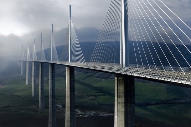 The Millau Viaduct - a multi-span cable-stayed bridge completed in  across the gorge valley of the Tarn in Southern France Designed by French engineer Michel Virlogeux and English architect Norman Foster As of July  the tallest bridge in the world with a 