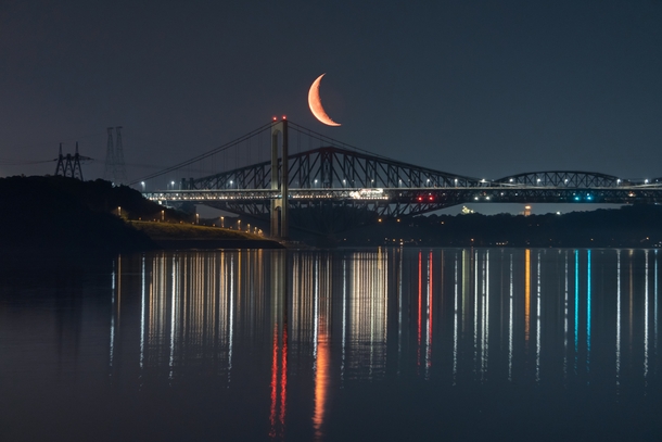 The Moon Rising over the Quebec bridges