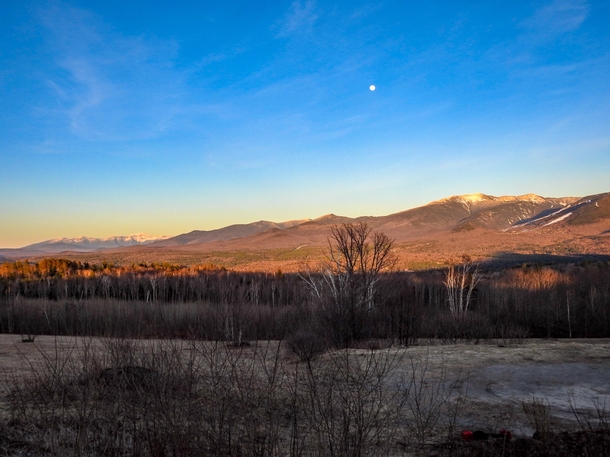 The Presidential Range and Franconia Notch in Alpenglow with a Full Moon Sugar Hill NH 