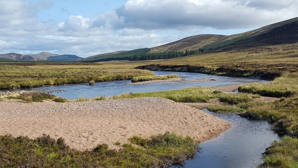 The quaint and elegant river Muick in the Cairngorms National Park Scotland 