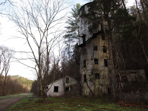 The Roundhouse is a strange abandoned location in my neck of the woods The structure began its life as a storage silo that held pulverized slate particles for the Tennessee Rock Products Company An eccentric local physician sought to transform it into a b