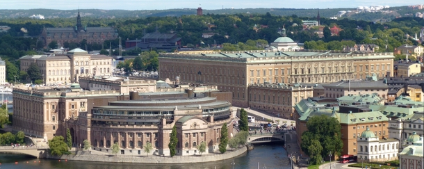 The Stockholm Palace to the right and the Parliament House to the left In the background the sunlit facade of the Nationalmuseum and the dome of the Skeppsholmen Church 