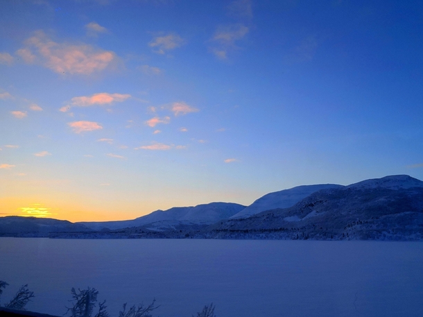 The sun barely under the horizon near Skoganvarre Finnmark County in Norway  x