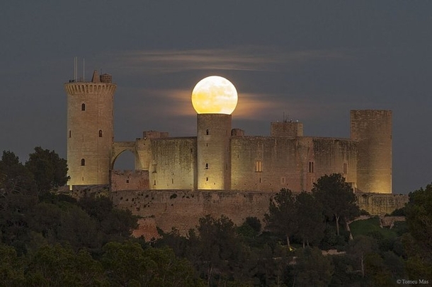 The supermoon over the Spanish Castle Its as if the moon is attached to it CreditNASA