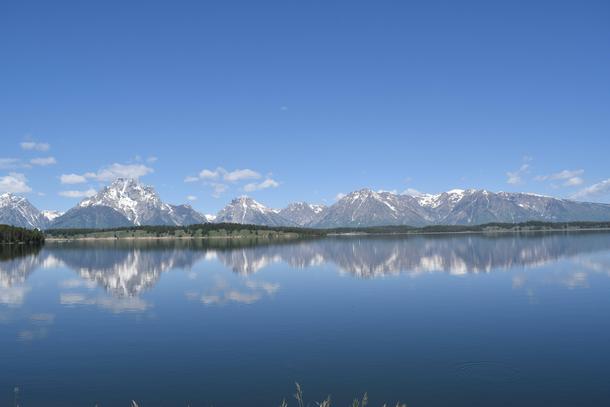 The Tetons reflecting over Jackson Lake 