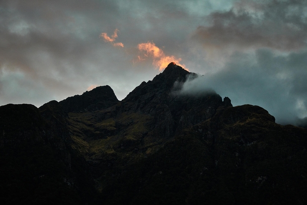 The tip is on fire Sunset near Milford Sound Fiordland National Park New Zealand 