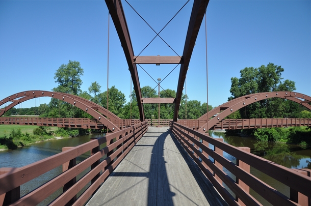 The Tridge - a three-way wooden footbridge spanning the confluence of the Chippewa and Tittabawassee Rivers in Chippewassee Park 