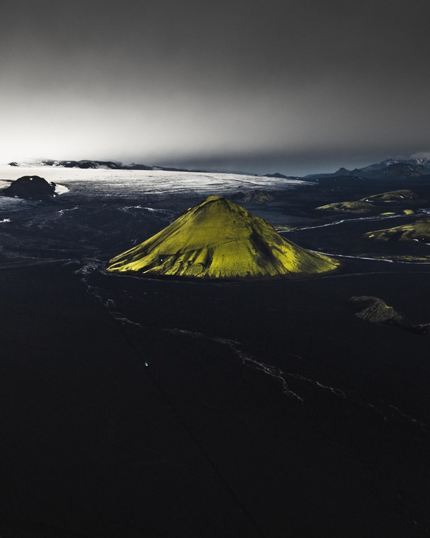 The volcano Mlifell surrounded by glacier and tephra desert in the Southern highlands of Iceland 