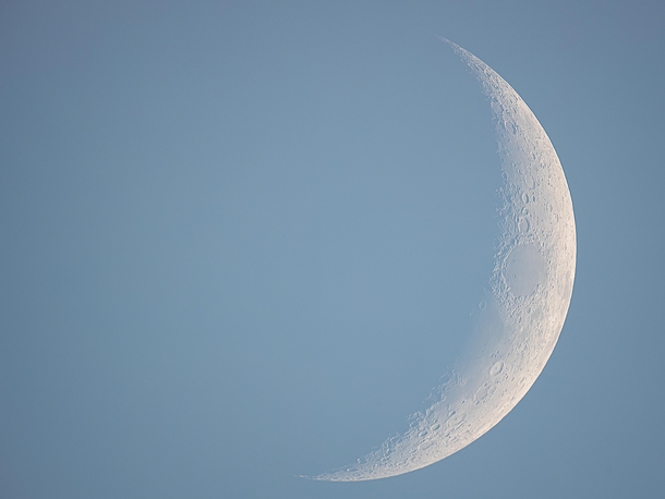 The waxing crescent Moon during daylight