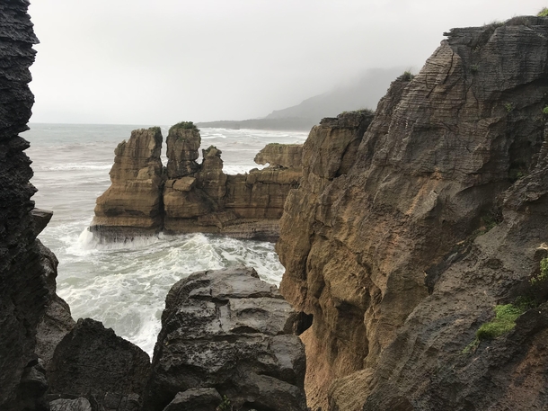The west coast in New Zealand is very rainy and different from the rest of the country Those cliffs are called Pancake Rocks 