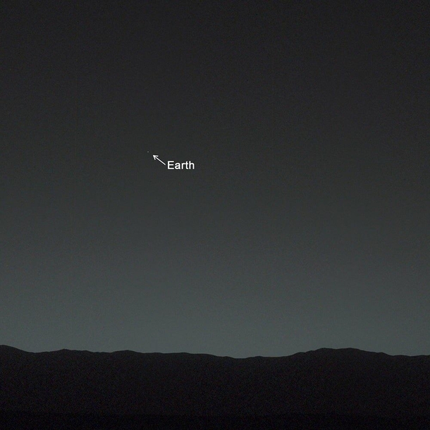 This amazing photo was actually taken from Mars Yup the planet Mars and that tiny star-like white dot there is our beloved Earth