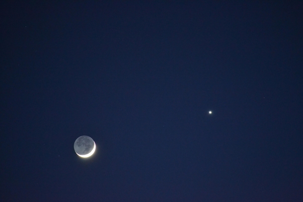 This beautiful picture I took of a lunar eclipse with Venus showing near it