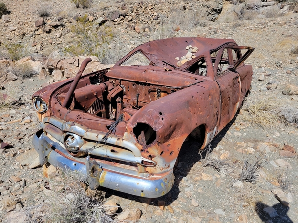 This car in the desert It crawled out there to die I guess Joshua Tree National Park CA found on a hike by nephew