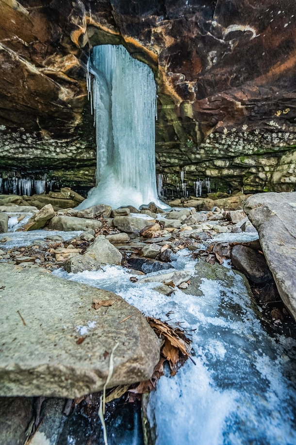 This frozen beauty right here is the Glory Hole a waterfall through the top of a bluff shelter in the Arkansas Ozarks 