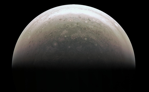 This image from NASAs Juno spacecraft provides a never-before-seen perspective on Jupiters south pole The JunoCam instrument acquired the view when the spacecraft was about  miles  kilometers above the polar region 