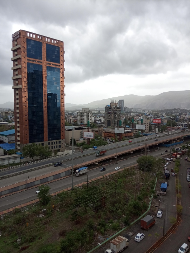 This is Navi Mumbai Navi means New Pictured is a highway connecting Mumbai to the rest of the world passing through This road infrastructure supports goods movement from Mumbais docks and also local passenger transport on rails and newly coming up Metro