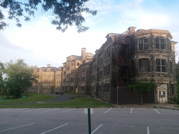 This is one of many closed down asylums outside of Baltimore Maryland I love these old buildings Based on the age of all the other buildings on this asylums campus tbis one is by far the oldest and main building they used The building probably has quite a