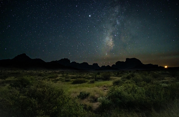 This is taken during that rare few minutes when the waxing crescent moon is visible at the same time as the Milky Way Big Bend National Park 