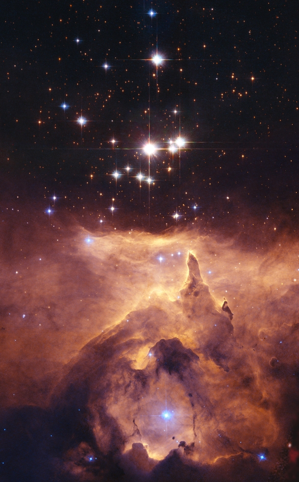 This is the open star clustser Pismis  in the core of the large emission nebula NGC  The largest of this triple star system in  solar masses