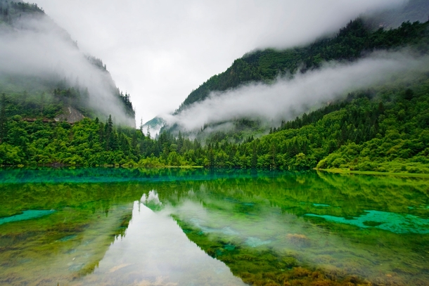 This is the other China High in the mountains of the Jiuzhaigou Nature Reserve visitors have discovered the sapphire-and-emerald-tinted waters of Five Colored Lake far removed from the industrial sprawl that consumes lives below  Photo by Michael S Yamash
