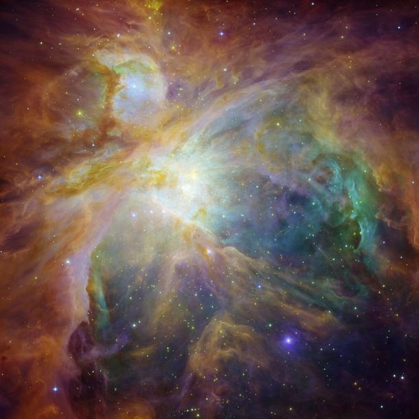 This masterpiece shows the Orion nebula in an explosion of infrared ultraviolet and visible-light colors It was painted by hundreds of baby stars on a canvas of gas and dust with intense ultraviolet light and strong stellar winds as brushes 