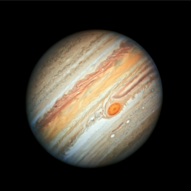 This new Hubble Space Telescope view of Jupiter taken on June   reveals the giant planets trademark Great Red Spot and a more intense color palette in the clouds swirling in Jupiters turbulent atmosphere than seen in previous years 