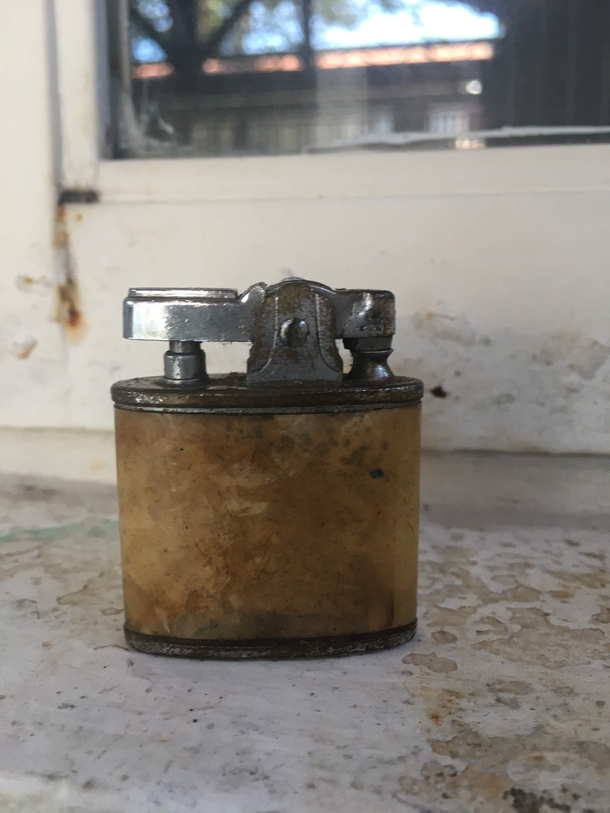 This very old lighter I found inside an abandoned grandpas tools chest
