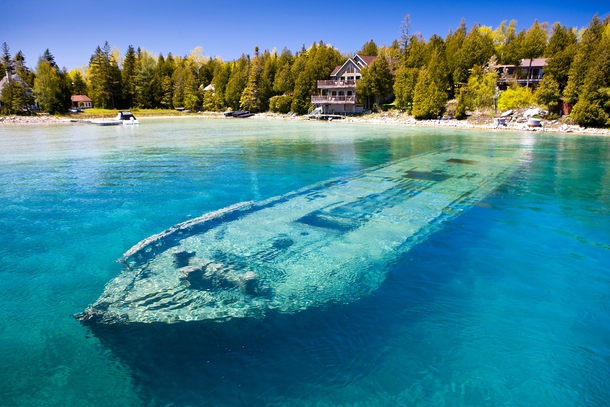 Though it sunk in  the Sweepstakes sits almost completely intact in just  feet of water in Lake Huron Rolf Hicker Photography 