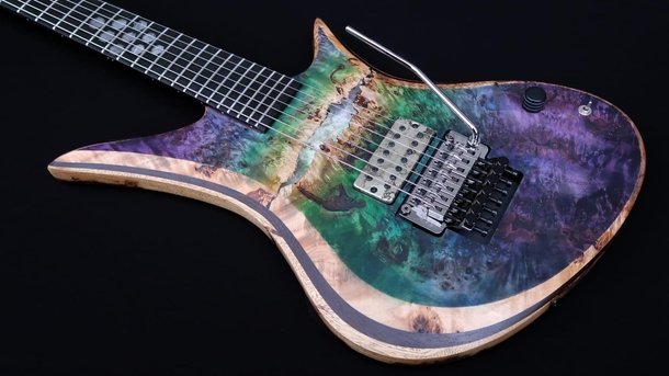 Thought You all might get a kick out of my space art guitar featuring the Tarantula Nebula and iron meteorite inlays