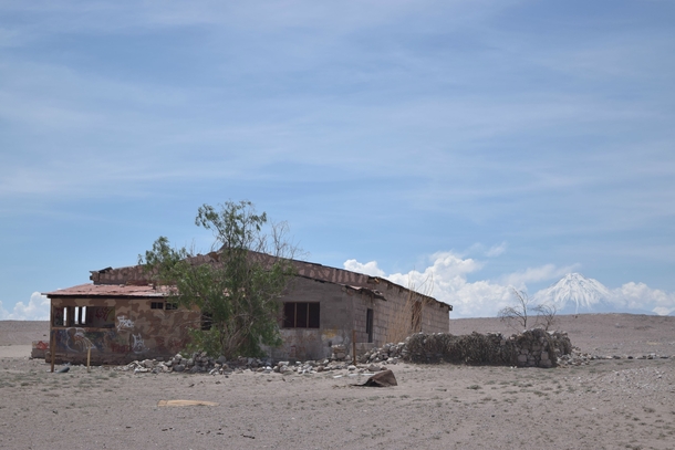 Toconao Chile -- an abandoned building with Licancabur Volcano in the distance 