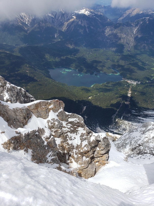 Top of the Zugspitze looking down at lake Eibsee  x