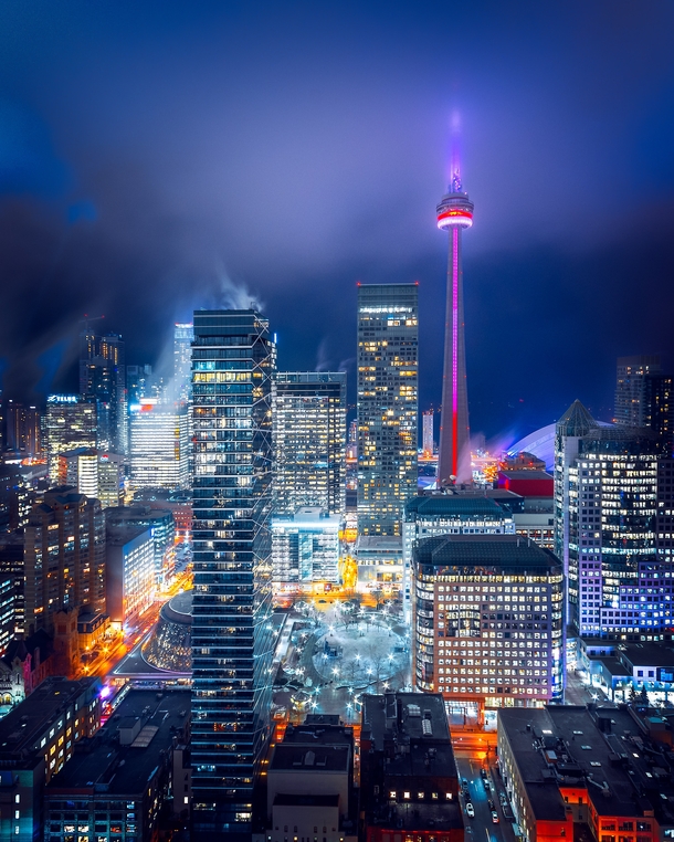 Toronto city scape in fog including the CN Tower Photo credit to Marcin Skalij