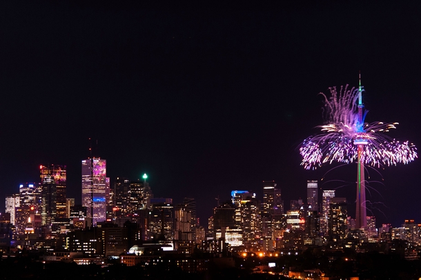 Toronto Pan Am Fireworks at the CN Tower reflecting off the Central Business District 