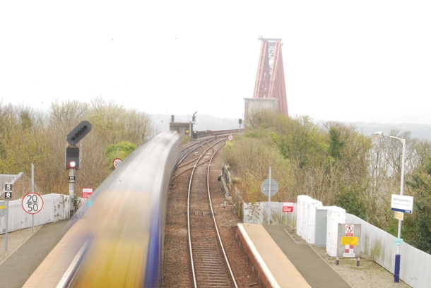 Train approaching the Forth Bridge at North Queensferry Scotland