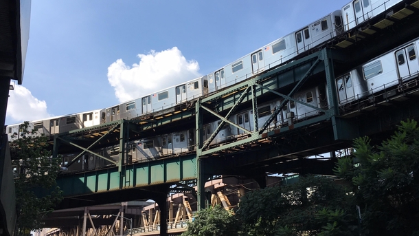 Two  trains on the elevated curve outside of Queensboro Plaza 